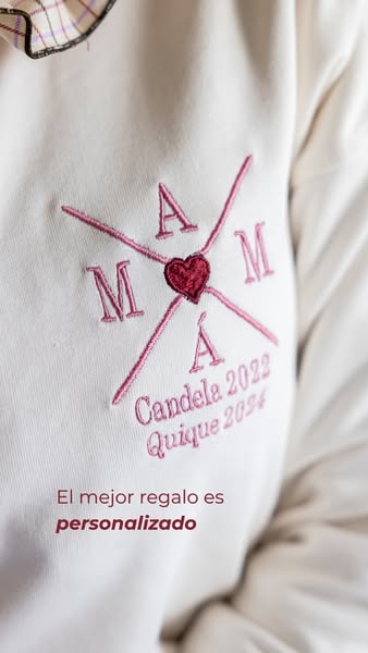 This image ad showcases a personalized embroidered sweatshirt as a gift idea. The ad uses a close-up shot of the embroid