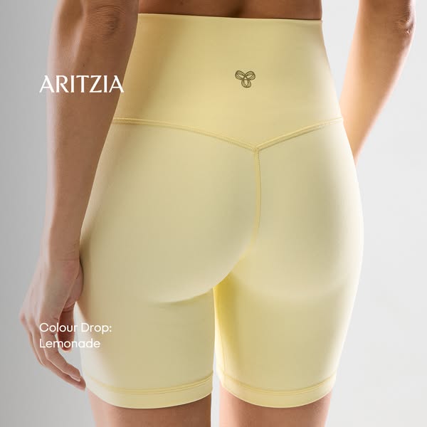This ad showcases Aritzia's Lemonade-colored shorts, highlighting their design and fit through a studio shot. The im