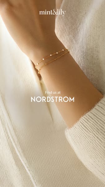 This image ad promotes Mint & Lily jewelry, available at Nordstrom. The visual emphasizes a dainty gold bracelet wor