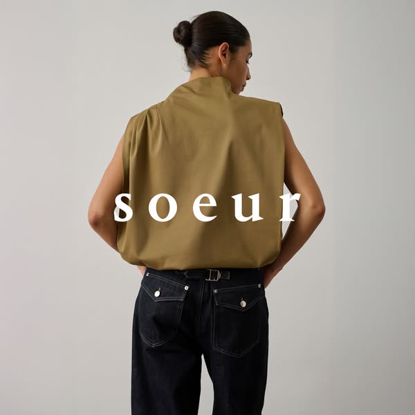This ad features a single image of a person wearing a tan sleeveless shirt and dark jeans, showcasing the brand's cl