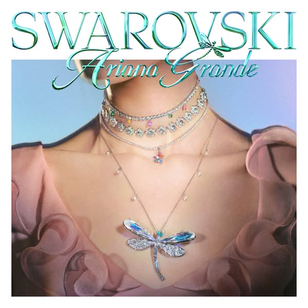 This ad features Ariana Grande wearing a variety of Swarovski crystal jewelry pieces including necklaces and a dragonfly