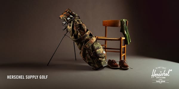This ad showcases Herschel Supply's golf collection, featuring a golf bag, shoes, and a golf towel. It emphasizes th