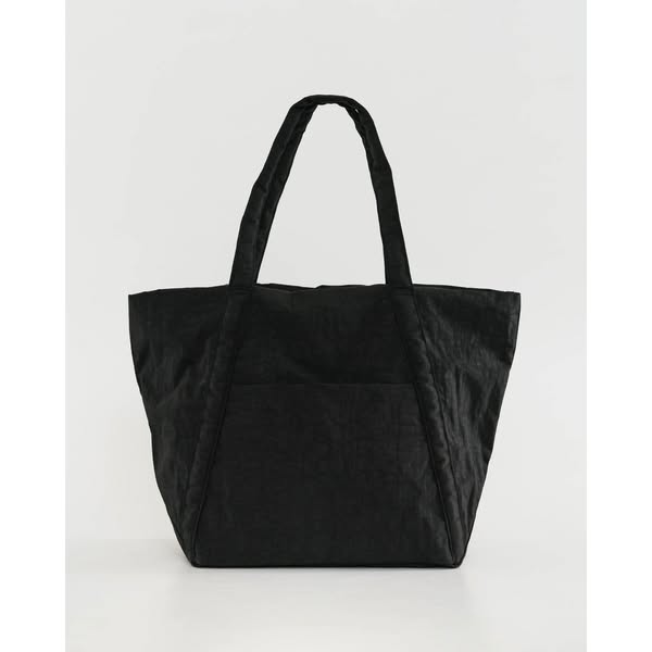 This ad features a black tote bag against a white background. The ad is a simple product showcase.