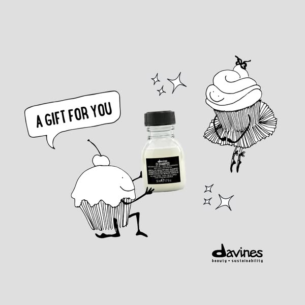 A Davines shampoo bottle is the center focus, presented as a gift between two cupcake characters.