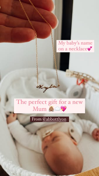 This image ad features a gold necklace with a baby's name on it, presented as the perfect gift for a new mom. The ad