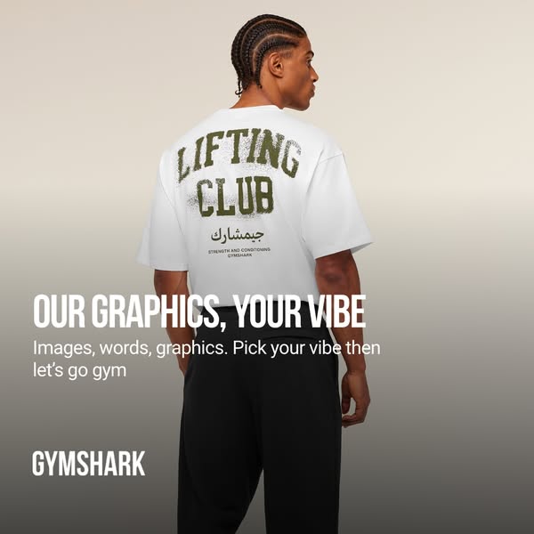 This ad promotes Gymshark's graphic tees. It features a man in workout clothes standing in front of a gradient backd