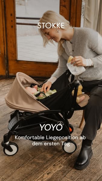 This ad for Stokke features a woman smiling at the baby in the Stokke YOYO bassinet.