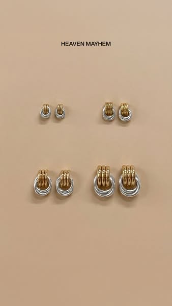 The ad displays four sets of Heaven Mayhem earrings, each successively larger in size. The earrings are two-tone, with g