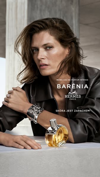 This ad showcases the new BARENIA eau de parfum intense by Hermès. The visual composition includes the model's upper
