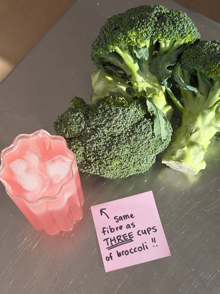 Image ad that highlights that a pink beverage has the same fiber as three cups of broccoli. This ad targets people who d