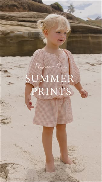 This ad features a young girl on the beach modeling clothes from Rylee + Cru's summer prints collection.