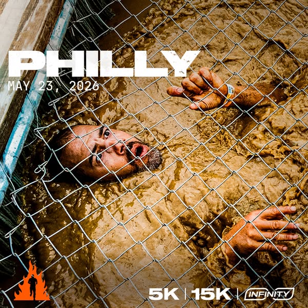 The ad promotes a 5k and 15k race called Philly. The image shows a person who is chest deep in muddy water and holding o