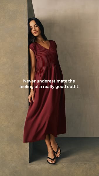 This ad features a woman wearing a long, red pleated dress. The ad's headline speaks to the feeling of wearing a goo