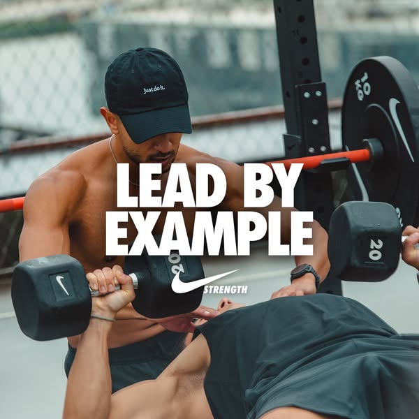 This Nike ad promotes the Nike Strength brand by showing a weightlifter training his client. The ad's headline '