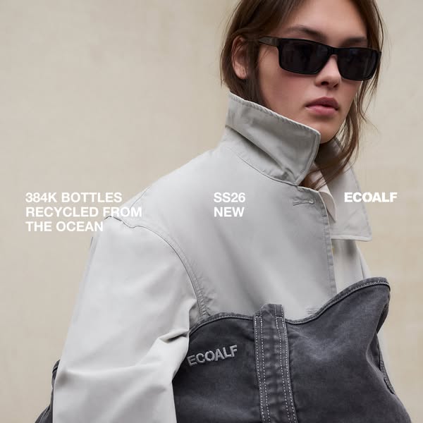 This Ecoalf ad features a model wearing a beige jacket and carrying a dark gray denim bag, both from the SS26 collection