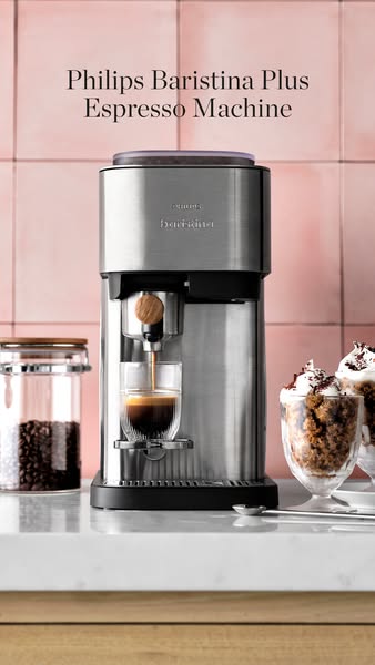 The ad features a Philips Baristina Plus Espresso Machine, demonstrating its ability to brew espresso. It's styled w