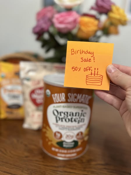 This image ad promotes Four Sigmatic's plant based organic protein powder with a handwritten note advertising a birt