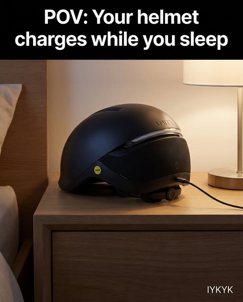 The ad displays a helmet on a nightstand, charging overnight. The point is to show how convenient the charging is for th