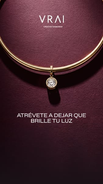 This ad for VRAI showcases a simple gold necklace with a created diamond pendant against a textured burgundy background.