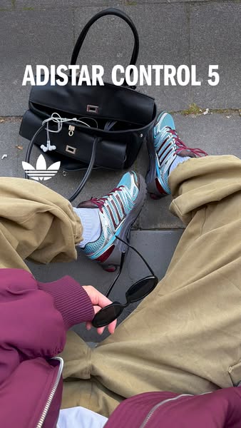 An image showcasing the Adidas Adistar Control 5 athletic shoes in a casual lifestyle setting.
