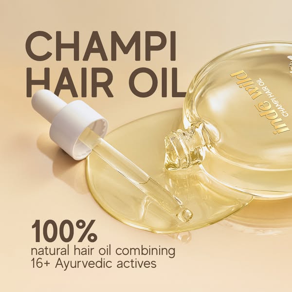 This image ad highlights the Inde Wild Champi Hair Oil. It features a close-up of the product bottle with a glass droppe