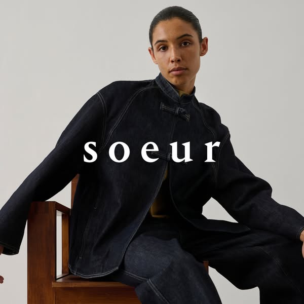 This ad features a photo of a person wearing a dark denim jacket and pants from the brand Soeur. The photo is a simple s
