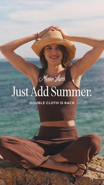 This ad for Marine Layer features a woman wearing a matching brown tank top and pants set on a sunny day, paired with th