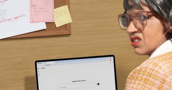 An image ad features a person with a distressed expression sitting in front of a laptop displaying the ChatGPT website.