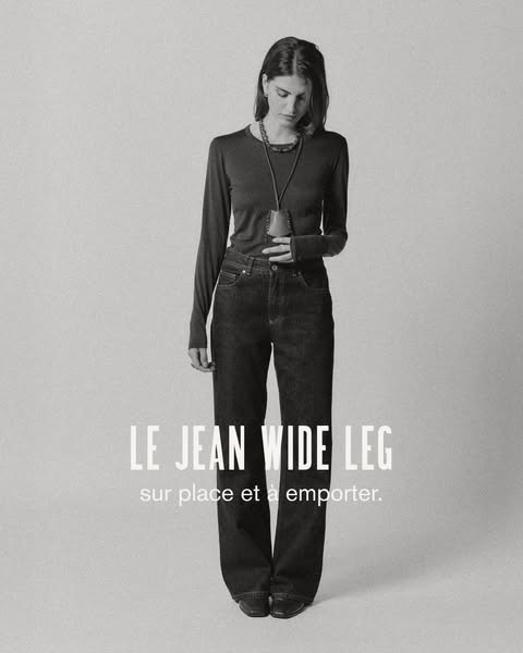 This is an image ad for a brand called LE JEAN and features LE JEAN WIDE LEG jeans. A woman is shown wearing a long-slee