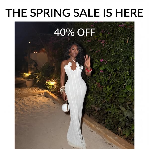 This image ad features a woman modeling a long white dress in an outdoor setting. The ad promotes a spring sale with a 4