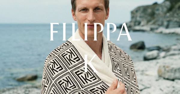 This image ad showcases a man wearing a robe from Filippa K, highlighting the brand's apparel.