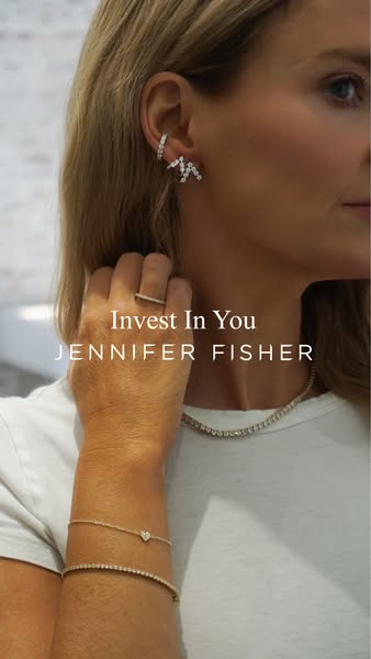 This ad showcases jewelry by Jennifer Fisher, encouraging viewers to 'Invest In You' by purchasing these items.