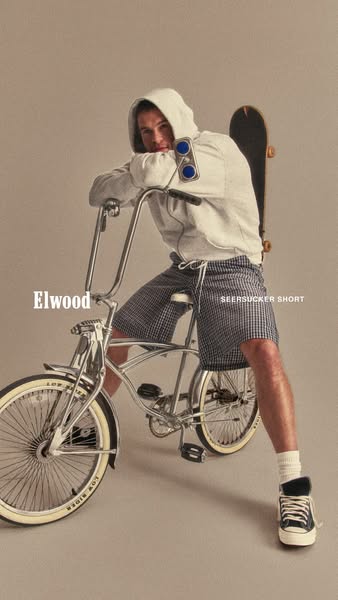 An Elwood ad featuring a person on a low rider bike modeling their Seersucker Shorts.