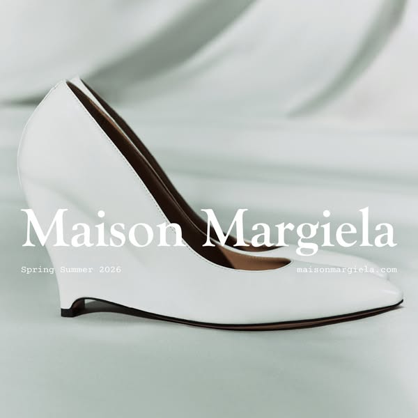 This image ad showcases a white pump with the Maison Margiela brand name over the shoe and their website and release dat