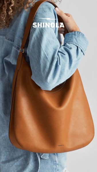 This ad features a woman holding a leather Shinola hobo bag over her shoulder. The close up product shot is intended to 