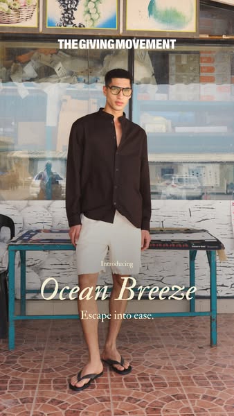 This ad by The Giving Movement features a man modeling a long sleeve button down shirt and shorts. The ad invites viewer
