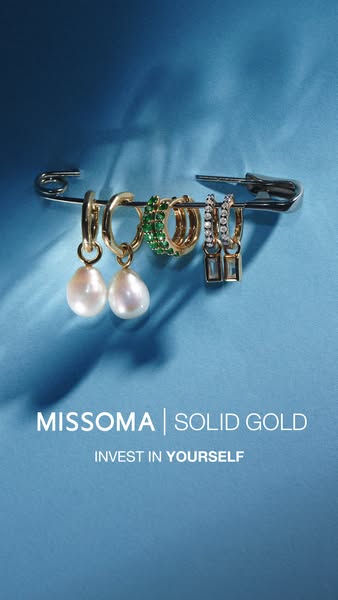 The ad showcases a selection of Missoma earrings, highlighting their solid gold construction and encouraging viewers to 