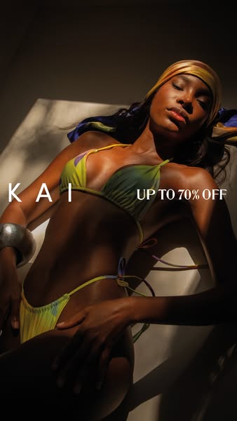 This image ad features a model wearing a tie-dye bikini from KAI, set against a backdrop of soft lighting and shadows. T