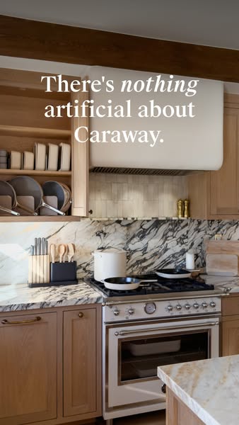 A lifestyle shot of a high-end kitchen featuring Caraway cookware. The headline highlights that Caraway is not artificia