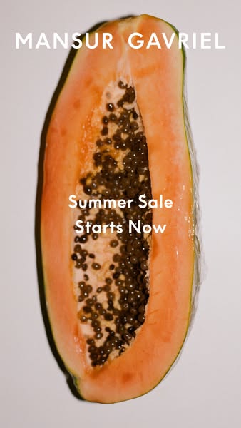 This image ad for Mansur Gavriel features a close-up of a papaya cut in half, with a summer sale message layered on top.