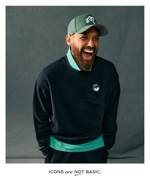 This ad promotes Malbon Golf apparel. The ad features a man wearing a Malbon Golf sweatshirt and hat smiling at somethin