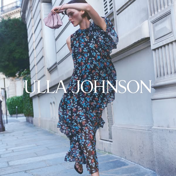 An ad featuring a model wearing an Ulla Johnson dress and carrying a purse. The ad showcases the brand's name promin