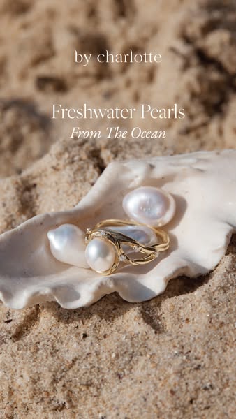 This ad for by charlotte features freshwater pearls, highlighting their origin from the ocean. A pearl ring is placed on