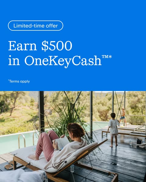 This image ad highlights a limited-time offer to earn $500 in OneKeyCash by showing a woman relaxing on a lounge chair.