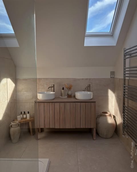 An image showcasing a bathroom vanity with a double sink, along with decorative elements, promoting a sense of calm and 