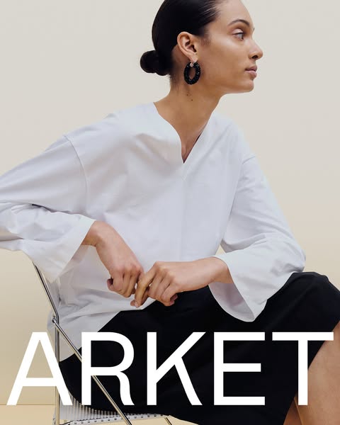 This ad features a woman modeling clothing from the brand ARKET. The ad focuses on the brand name.