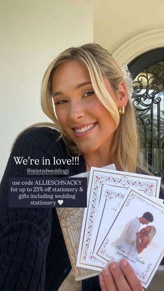 A creator advertises Minted Weddings. She holds a stack of various stationery from Minted Weddings, showing designs such