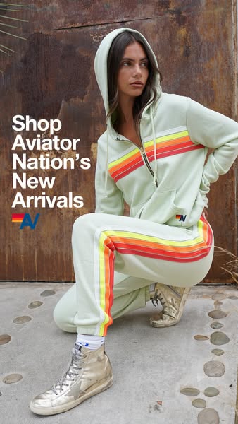 This ad showcases Aviator Nation's new arrivals, featuring a model wearing a matching hoodie and sweatpants set with