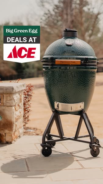 This image ad shows a Big Green Egg grill and promotes deals at Ace Hardware. The ad's setting is outdoors.