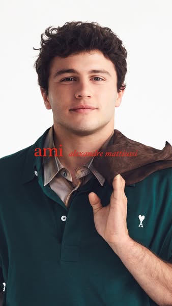 This image ad features a man wearing a dark green polo shirt with the brand's logo embroidered on the left side. The